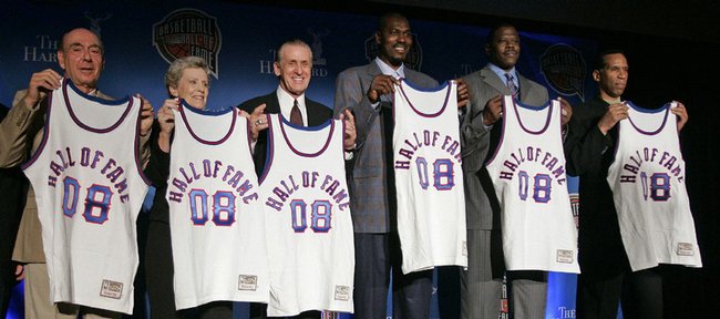 Basketball Hall of Fame selections, from left, Dick Vitale, Cathy Rush, Pat Riley, Hakeem Olajuwon, Patrick Ewing and Adrian Dantley are seen at a news conference Monday in San Antonio.