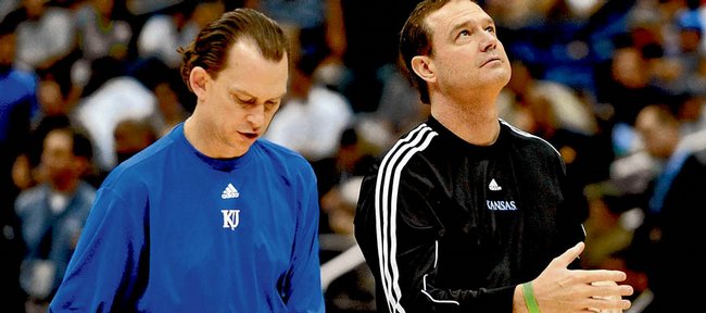 Kansas University assistant basketball coach Joe Dooley, left, tests out basketballs with head coach Bill Self at a practice at the 2008 Final Four.