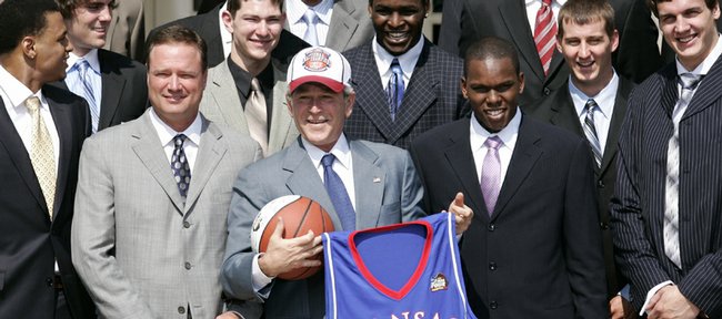 President Bush stands with members of the 2008 NCAA men's national basketball championship team from the University of Kansas, Tuesday, June 3, 2008, in the Rose Garden of the White House in Washington. 