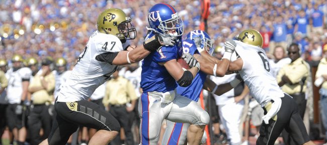 Kansas' Jake Sharp drags Colorado's Shaun Mohler into the end zone on Saturday, Oct. 11, 2008 at Memorial Stadium.  Sharp scored three touchdowns in the game.
