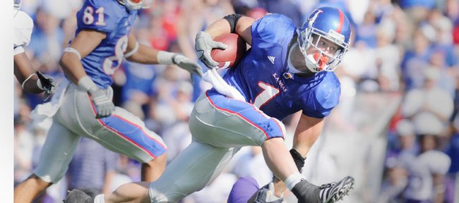 Kansas University’s Jake Sharp (1) bowls over a Kansas State defender in this file photo from Nov. 1, 2008. Sharp rushed for 181 yards against the Wildcats.