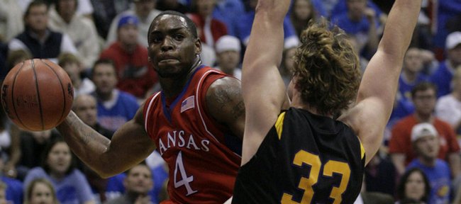 KU's Sherron Collins looks to pass against Albany in Allen Fieldhouse on Tuesday, Dec. 30, 2008
