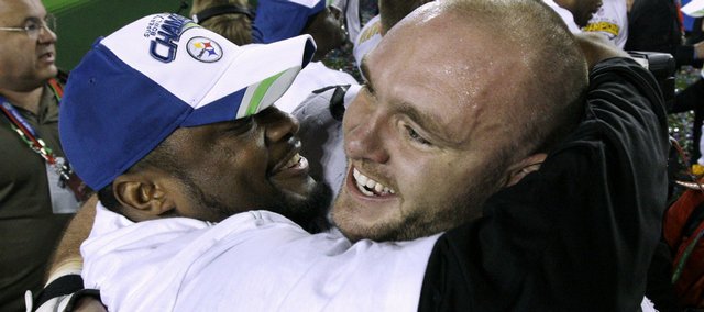 Pittsburgh Steelers center and former kansas university football player justin hartwig, right, celebrates with coach Mike Tomlin after their 27-23 Super Bowl victory over the Arizona Cardinals on Feb. 1 in Tampa, Fla. Hartwig, who played center for Kansas from 1998-2001, was relieved that his holding penalty in the end zone didn’t cost Pittsburgh a championship.