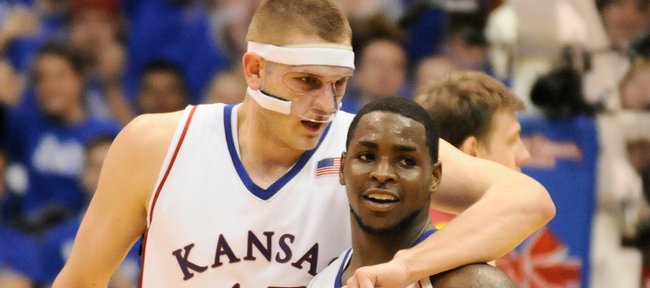 Kansas center Cole Aldrich puts his arm around guard Sherron Collins as the two make their way from the floor late in the second half against  Iowa State Wednesday, Feb. 18, 2009 at Allen Fieldhouse.