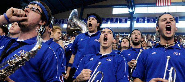 Members of the Kansas University basketball band get wild as they perform the Rock Chalk Chant prior to tipoff against Nebraska in this file photo. With the departure of the 'Huskers and Colorado, KU may have to change up the wording in its fight song.