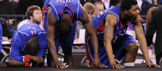 Kansas players, from left, Tyrone Appleton, Mario Little and Marcus Morris can't watch the final moments of the Jayhawks' loss to Michigan State during the second half Friday, March 27, 2009 at Lucas Oil Stadium in Indianapolis.