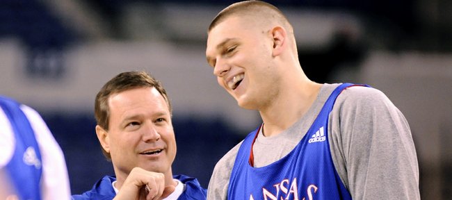 Kansas head coach Bill Self and center Cole Aldrich laugh during practice Thursday at Lucas Oil Stadium in Indianapolis.