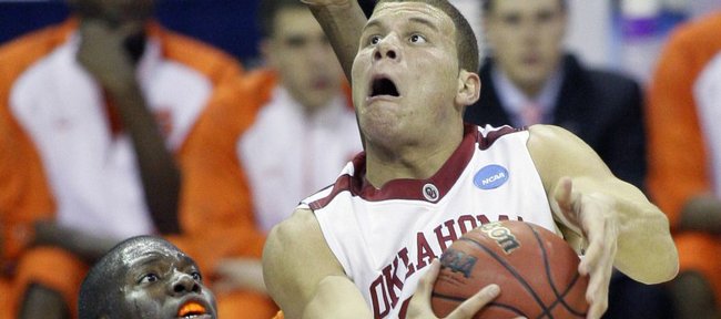 Oklahoma forward Blake Griffin (23) drives to the basket against Syracuse forward Rick Jackson (00) in the first half of a men's NCAA tournament regional semifinal college basketball game in Memphis, Tenn., Friday, March 27, 2009.