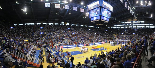A crowd of more than 16,000 basketball fans watch the women’s Kansas University basketball team prepare to take on the South Florida bulls in the WNIT championship game Saturday in Allen Fieldhouse. The crowd was the largest ever to watch a KU women’s game in the fieldhouse. 