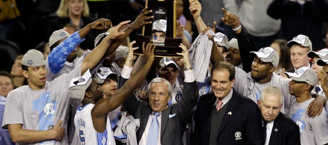 North Carolina coach Roy Williams, center, celebrates with his team after the Tar Heels’ 89-72 victory over Michigan State. Carolina easily defeated the Spartans in the NCAA championship game on Monday in Detroit.
