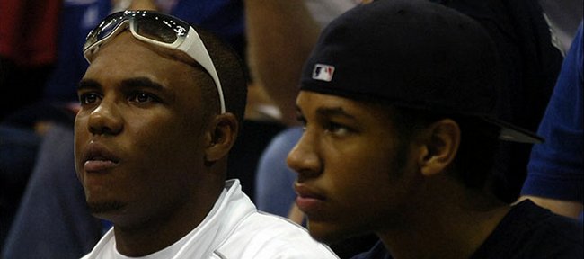 KU recruit Xavier Henry, right, and brother C.J. take in the Late Night festivities in this 2005 file photo. C.J. was admitted to KU on Tuesday.