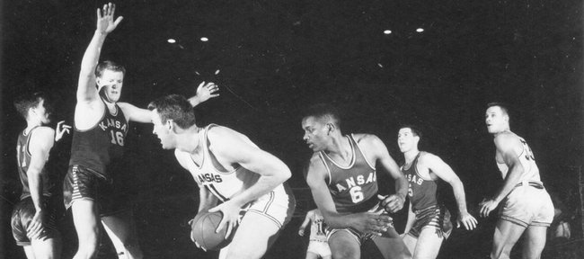 The 1951-1952 Kansas University basketball team practices in this file photo. The team, which featured Bill Lienhard (#11), Clyde Lovellette (#16), LaVannes Squires (#6) and Charlie Hoag (#5), notched the program's 700th victory by defeating Missouri in a game played in Kansas City, Mo. The Jayhawks later went on to defeat St. John's in the national championship game, 80-63.