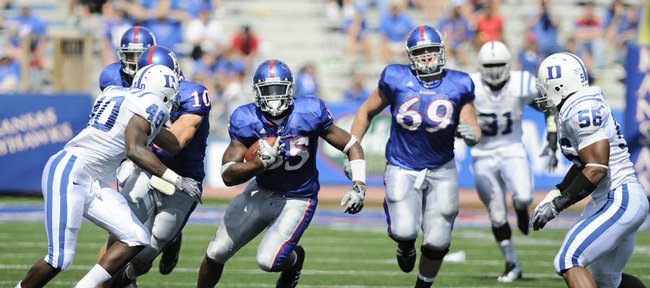 Kansas running back Toben Opurum looks for a hole as he charges up field against the Duke defense during the fourth quarter Saturday at Memorial Stadium.