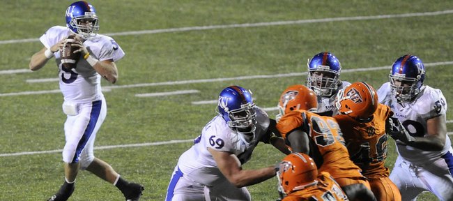 The Kansas offensive line buys quarterback Todd Reesing time against UTEP on Sept. 12 in El Paso, Texas. The offensive line earned praise from coach Mark Mangino this week.