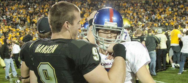 Colorado quarterback Tyler Hansen congratulates a dejected Todd Reesing after the Buffaloes' 34-30 win over the Jayhawks Saturday, Oct. 17, 2009 at Folsom Field.