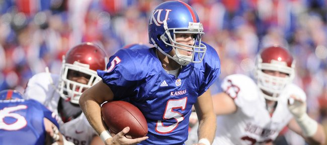 Kansas university quarterback Todd Reesing tries to escape from pressure during the first half against Oklahoma on Saturday at Memorial Stadium. Reesing has struggled lately, but will try to regain some swagger on Saturday against Texas Tech in Lubbock, Texas.