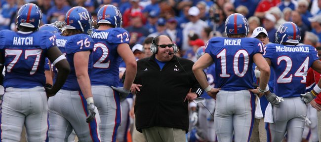 Kansas head coach Mark Mangino scans his offense during a timeout in the Jayhawks’ game against Oklahoma on Oct. 24 at Memorial Stadium. Mangino is under investigation for allegedly poking a player.