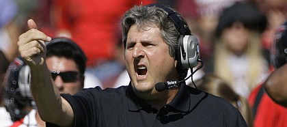 Texas Tech coach Mike Leach directs his team against Texas A&M in this file photo from Oct. 18 in College Station, Texas.