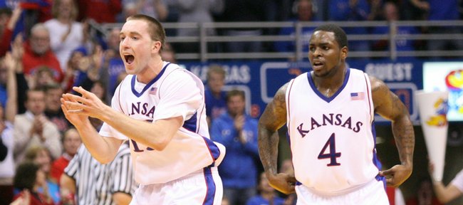 Kansas guard Brady Morningstar (left) celebrates a three pointer by teammate Tyrel Reed against Cornell during the second half, Wednesday, Jan. 6, 2009 at Allen Fieldhouse.