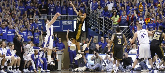 The Fieldhouse crowd rises to its feet as Kansas guard Tyrel Reed hits a three pointer over Missouri forward Keith Ramsey during the second half, Monday, Jan. 25, 2010 at Allen Fieldhouse.