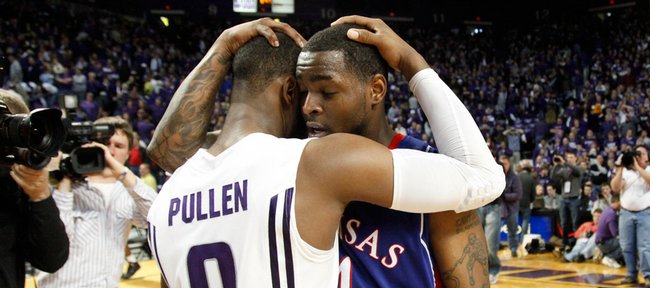 Chicago natives Jacob Pullen and Sherron Collins embrace after the Jayhawks' 81-79 win over the Wildcats after overtime, Saturday, Jan. 30, 2010 at Bramlage Coliseum.
