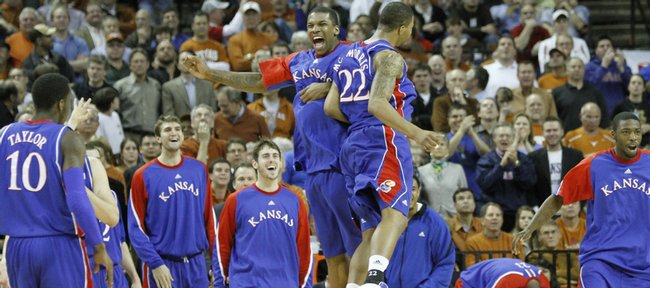 Kansas forward Thomas Robinson and Marcus Morris give each other a flying chest bump during a Jayhawk run against Texas in the first half, Monday, Feb. 8, 2010 at the Frank Erwin Center in Austin.