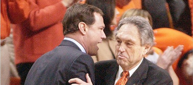 
Kansas coach Bill Self, left, congratulates Oklahoma State's Eddie Sutton after the Jayhawks' 80-60 loss to OSU in their last trip to Stillwater, Okla. Self made his first trip to his alma mater as coach of the Jayhawks for that "embarrassing" setback on Feb. 9, 2004. His second trip back is today.