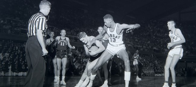 Wilt Chamberlain plays in his first game as a Kansas Jayhawk against Northwestern University on 1956. Wilt had 52 points and 31 rebounds in his debut.