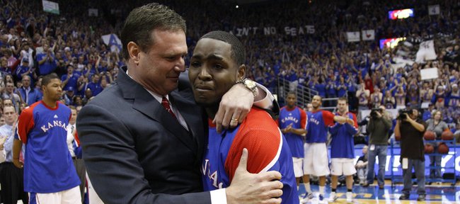 Kansas senior point guard Sherron Collins gets an emotional hug from head coach Bill Self as he is honored by the Allen Fieldhouse crowd before tipping off against Kansas State, Wednesday, March 3, 2010.