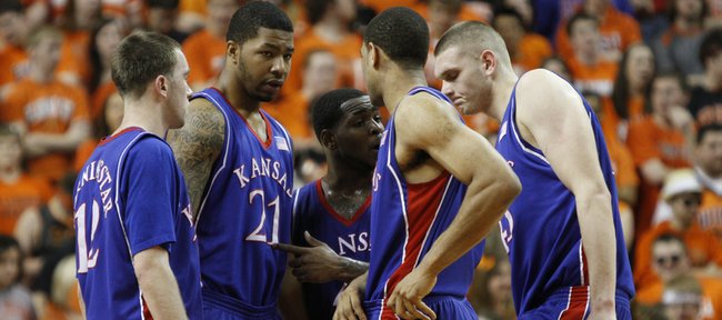 Kansas players Brady Morningstar, left, Markieff Morris, Sherron Collins, Xavier Henry and Cole Aldrich huddle during a break from an Oklahoma State run in the first half, Saturday, Feb. 27, 2010 at Gallagher-Iba Arena in Stillwater.