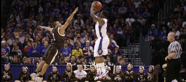 Kansas guard Sherron Collins takes a three-pointer over Lehigh guard Marquis Hall during the first half Thursday, March 18, 2010 at the Ford Center in Oklahoma City.