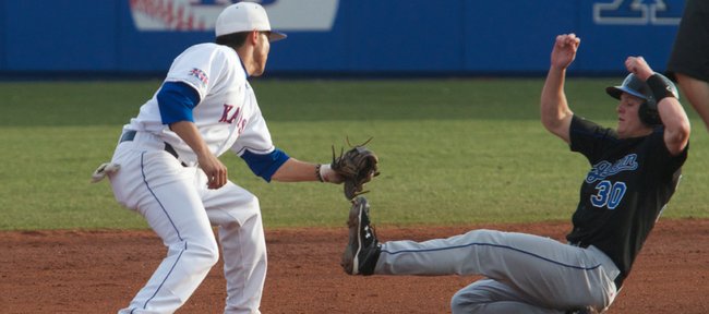 KU shortstop Brandon Macias gets a tag down on a Creighton baserunner for an out in the game on Saturday, March 23, 2010.