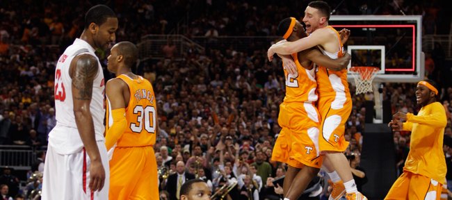 Tennessee's Scotty Hopson, left, and Steven Pearl embrace after their 76-73 win over Ohio State of an NCAA Midwest Regional college basketball game Friday, March 26, 2010, in St. Louis. At left are Ohio State players David Lighty (23) and Evan Turner (21).