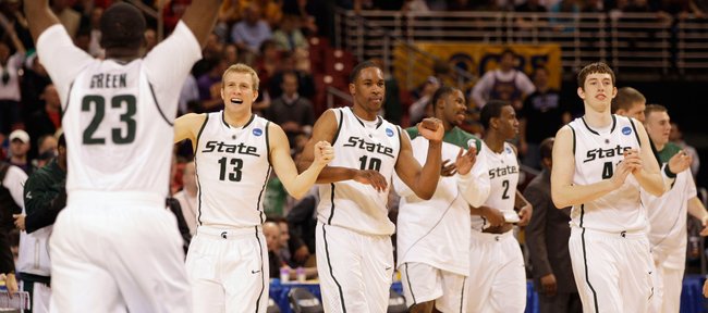 Michigan State players celebrate in the closing seconds of their 59-52 win over Northern Iowa in an NCAA Midwest Regional college basketball game Friday, March 26, 2010, in St. Louis.