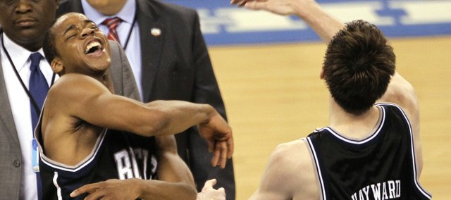 Butler players Ronald Nored (5) and Butler's Gordon Hayward (20) celebrate after their 52-50 win over Michigan State in a men's NCAA Final Four semifinal college basketball game Saturday, April 3, 2010, in Indianapolis.