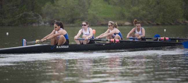 Rowers on Kansas' Varsity 4 boat get warmed up before their race in the Big 12 Championships on Saturday, May 2, 209, at Wyandotte Co. Lake.