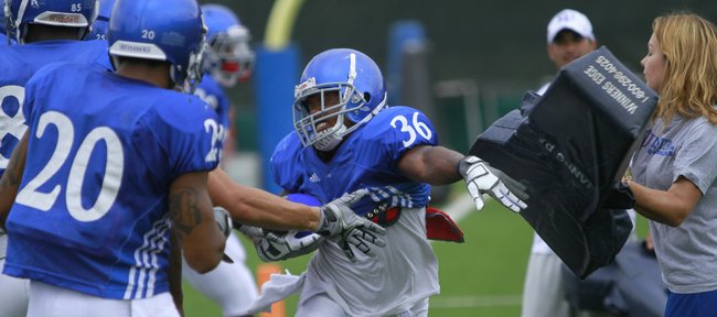Kansas running back Deshaun Sands breaks through during practice Tuesday, Aug. 17, 2010. Sands is among several running backs competing for playing time.