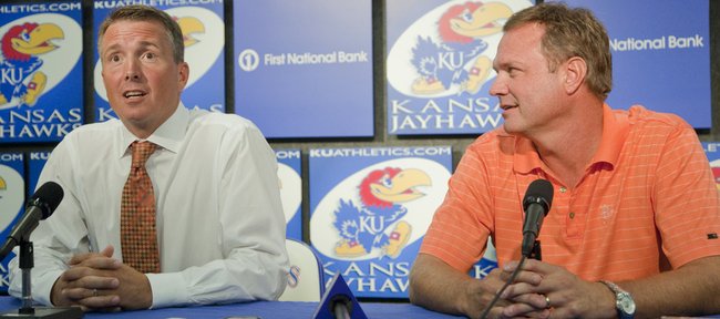 Sean Lester, left, an associate athletics director, is introduced as the interim athletics director Tuesday at KU. KU men's basketball coach Bill Self also attended the press conference with Lester. In a statement on the Kansas University website Tuesday, Chancellor Bernadette Gray-Little and Athletic Director Lew Perkins announced that Perkins will retire, effective immediately.