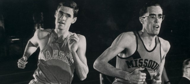 Kansas runner Jim Ryun, left, attempts to pass Missouri’s Glenn Ogden in this file photo. Ryun was the first high schooler to run a sub-four-minute mile. The distance isn’t run often at the high school level anymore.