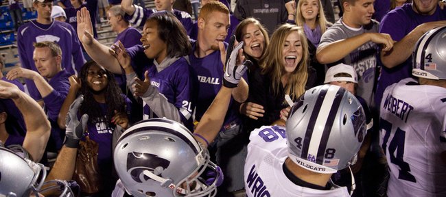 Kansas State fans celebrate with the Wildcats after their 59-7 win over Kansas, Thursday, Oct. 14, 2010 at Kivisto Field.