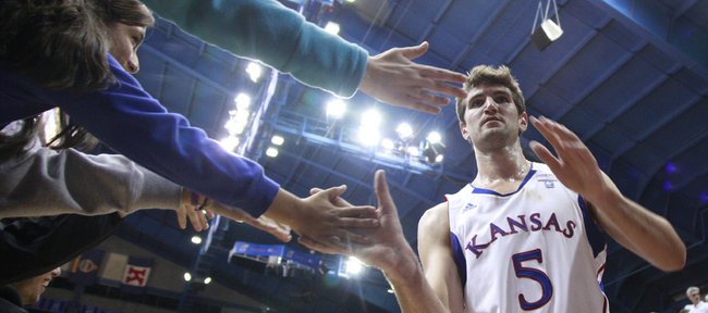 Kansas center Jeff Withey slaps hands with fans as he exits the court following the Jayhawks' 113-75 win over Longwood, Friday, Nov. 12, 2010 at Allen Fieldhouse.