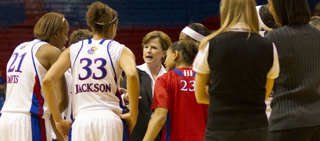 Kansas University head coach Bonnie Henrickson talks to her team during a timeout in their game against Memphis Saturday, Nov. 27, 2010 at Allen Fieldhouse. The Jayhawks were too much for the Tigers, beating them 90-58.
