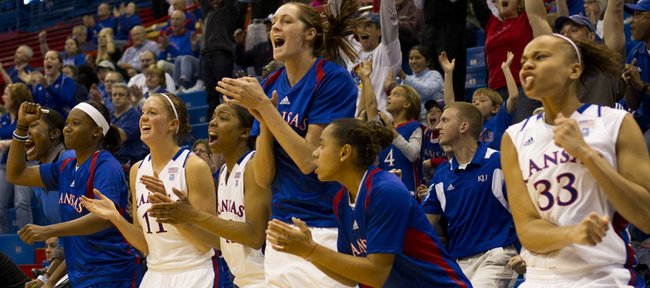 The Kansas bench reacts as Kansas ties the game up at 59 during the team's game against Fordham Sunday afternoon in Allen Fieldhouse. The Jayhawks won in overtime, 81-68.
