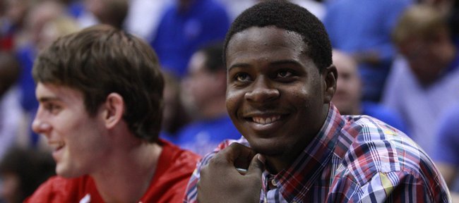 Kansas guard Josh Selby smiles as he hears the student section chant "Free Selby" during the second half, Monday, Nov. 15, 2010 at Allen Fieldhouse. Selby is still waiting to be cleared to play by the NCAA.