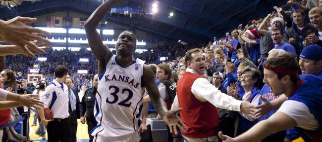 Kansas guard Josh Selby salutes the Allen Fieldhouse crowd as he leaves the court following the Jayhawks' 70-68 win over USC, Saturday, Dec. 18, 2010. Selby made his debut with 21 points and hit what proved to be the game winning shot with 24 seconds left.
