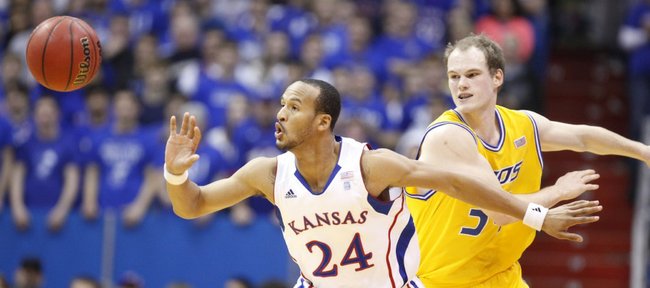Kansas guard Travis Releford knocks the ball away for a steal from UMKC forward Max Rockmann during the first half on Wednesday, Jan. 5, 2011 at Allen Fieldhouse.