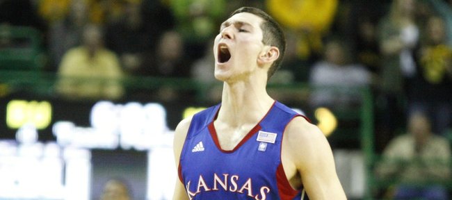 Kansas guard Tyrel Reed roars after a dunk by teammate Thomas Robinson against Baylor during the first half on Monday, Jan. 17, 2011 at the Ferrell Center in Waco, Texas.