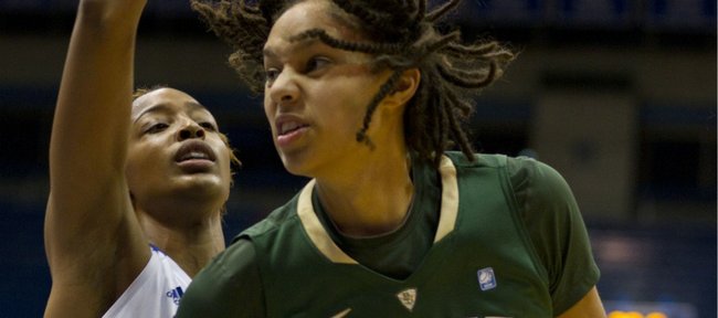 Baylor center Brittney Griner makes a move around Kansas forward Carolyn Davis. Griner had 22 points, 15 rebounds and five blocked shots in the top-ranked Bears’ 76-37 rout Wednesday, Jan. 19, 2011 at Allen Fieldhouse.