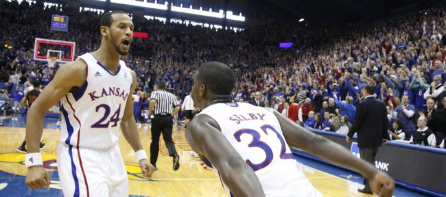 Kansas guards Travis Releford, left, and Josh Selby celebrate the Jayhawks' 70-68 win over USC, Saturday, Dec. 18, 2010 at Allen Fieldhouse.