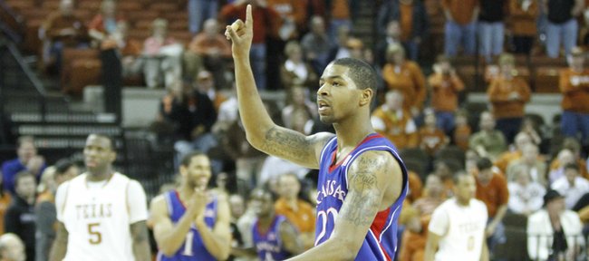 Kansas forward Marcus Morris holds up a number one as the Jayhawks leave the court following their 80-68 win over Texas on Feb. 8, 2010 at the Frank Erwin Center in Austin. The two teams renew their rivalry on Saturday in Allen Fieldhouse.